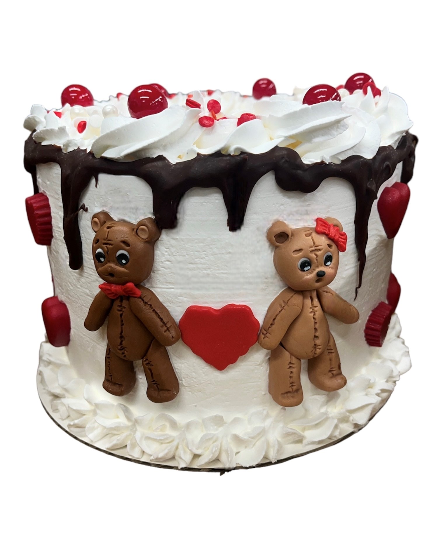 Valentine's ice cream cake with fondant teddy bears, chocolate drip, and red hearts
