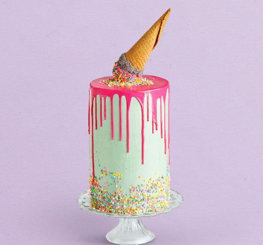 A decorated custom ice cream cake with colorful toppings
